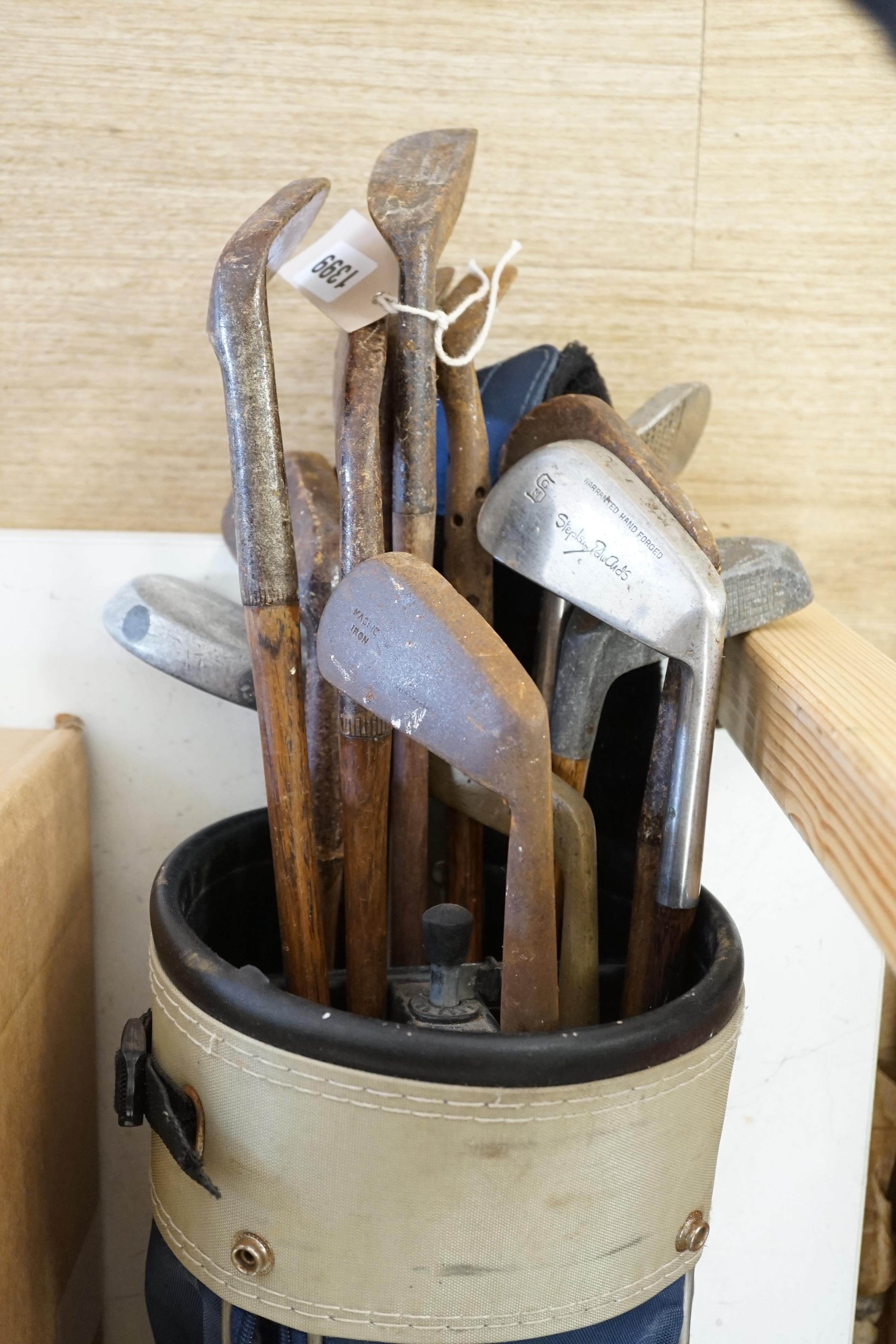 A collection of golf clubs, largely hickory shafted with two cases. Condition - varies